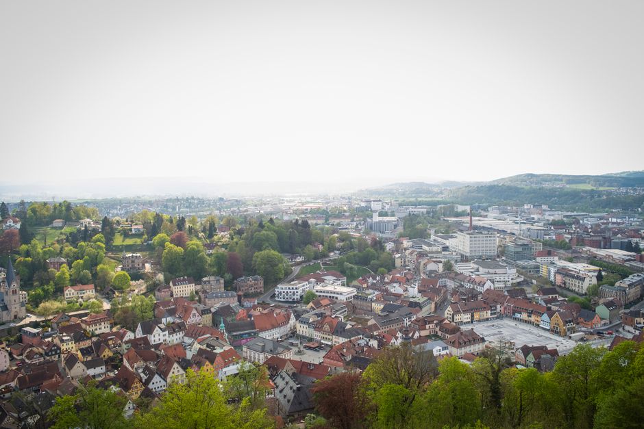 Explore the historic charm of Kulmbach, Germany, with its scenic cityscape and lush greenery from above.