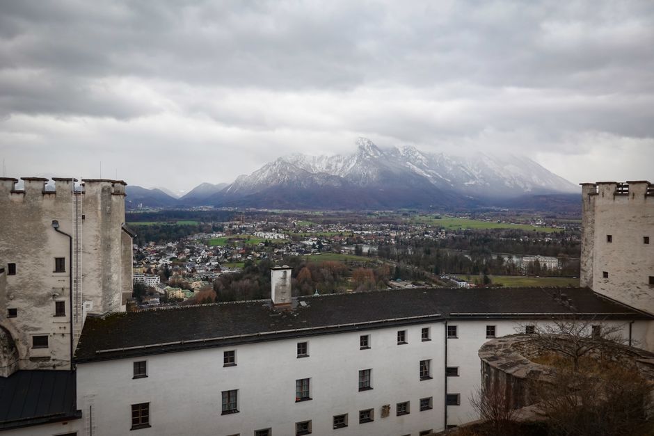 Scenic panorama of Salzburg cityscape with Alps in the background from the fortress rooftop.
